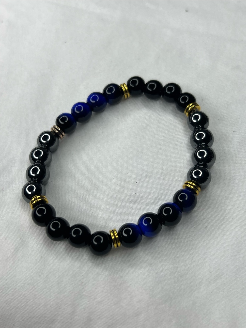 Black zinc and Cobalt Blue Tiger eye Beaded Stretch Bracelet with Gold Accents